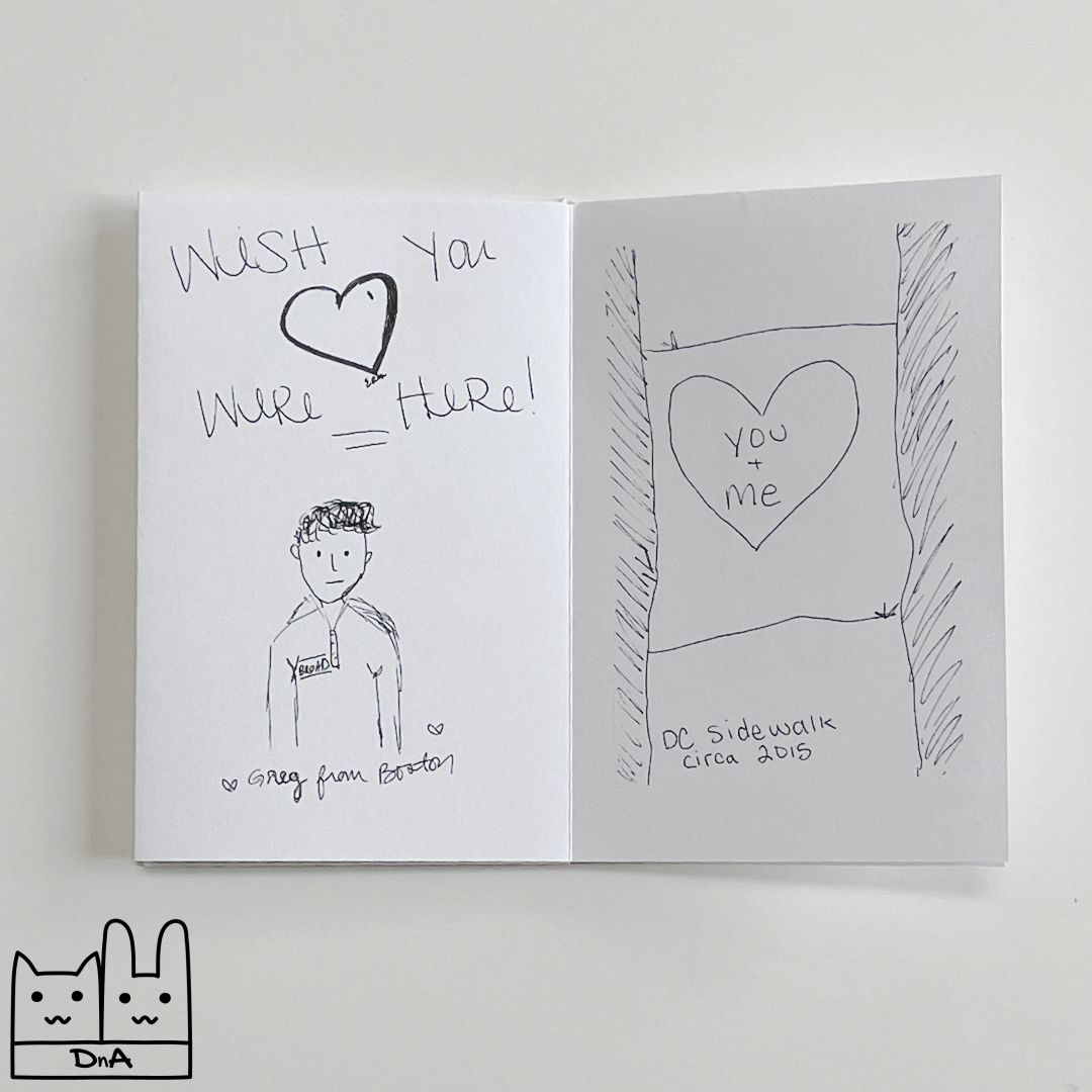 A photo of the interior of issue 1, showing the message 'Wish you were here!' a drawing of a man with hears which says 'Greg from Boston' and a drawing of the sidewalk with 'you + me' written inside the heart and captioned 'DC sidewalk circa 2015'